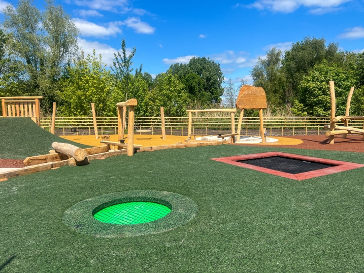 Two inground tampolines on a wet play area at martin mere